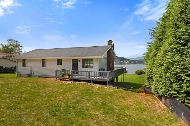 2793 Hidden Valley Rd, Hiawassee, GA 30546 - back of house with a chimney, a lawn, and a deck with water view