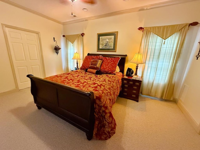 bedroom with ceiling fan, ornamental molding, light colored carpet, and multiple windows