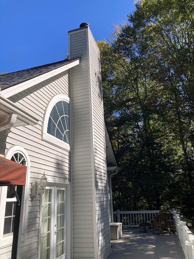 view of side of property with french doors