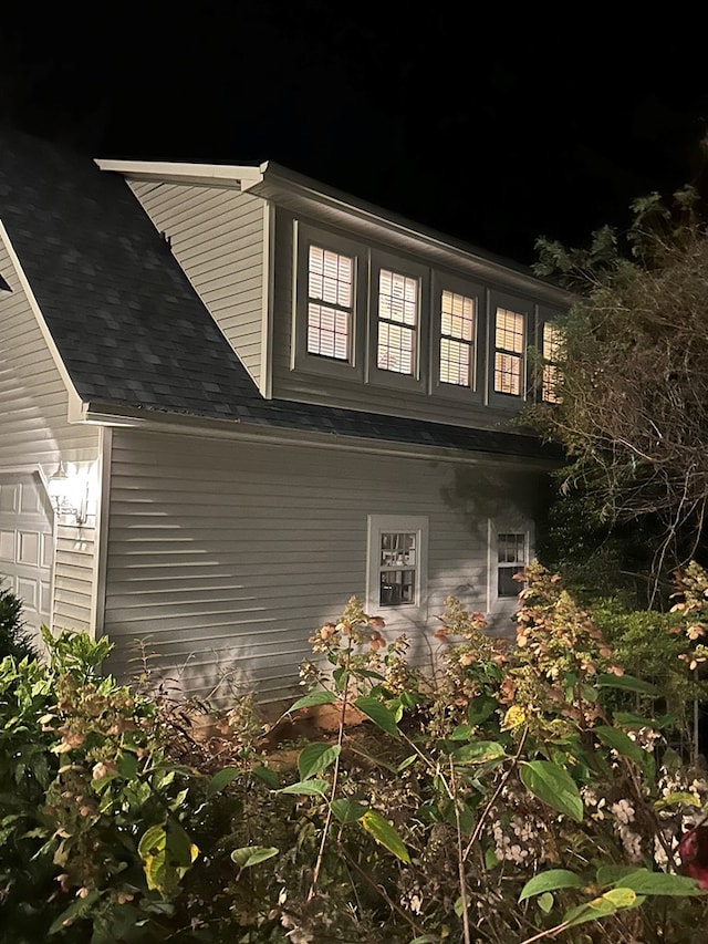 view of side of home with a garage