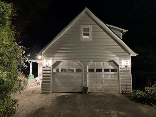 view of garage at night