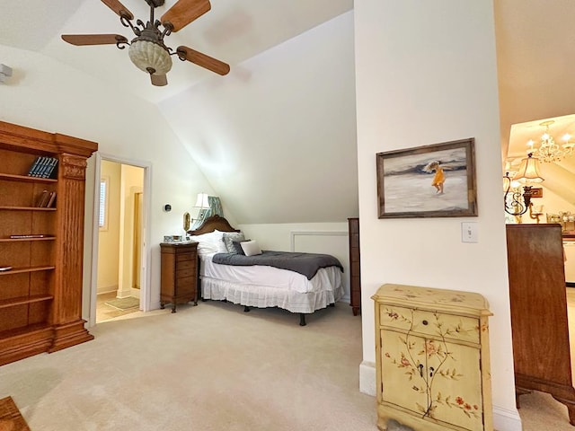 bedroom with light carpet, ceiling fan, lofted ceiling, and connected bathroom