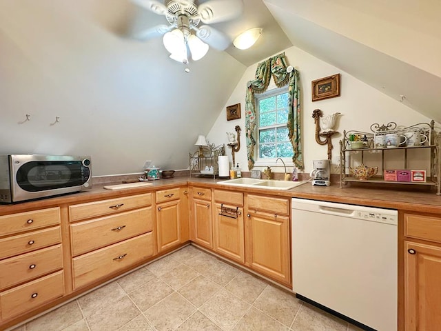 kitchen featuring lofted ceiling, ceiling fan, sink, white dishwasher, and light tile patterned floors