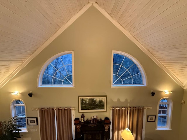 interior space featuring high vaulted ceiling and crown molding