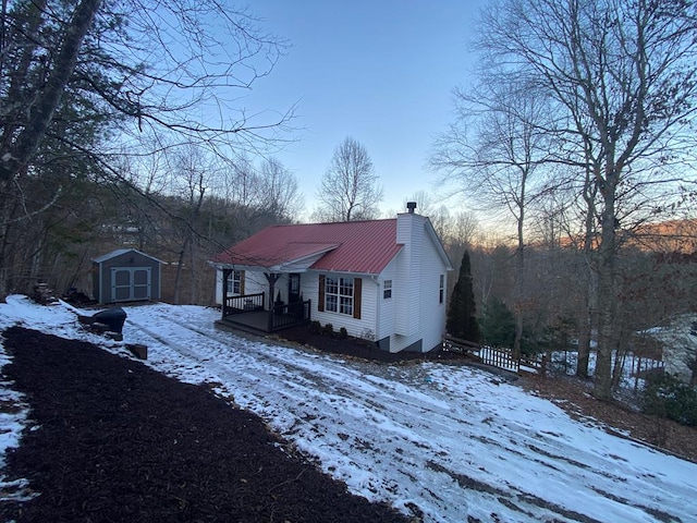 view of front of house featuring a shed