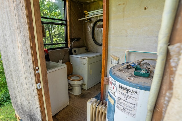 318 Page Ln, Murphy, NC 28906 - laundry area featuring washer / dryer, wood finished floors, and radiator heating unit