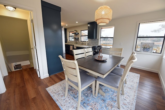 dining room featuring dark wood-style floors, recessed lighting, and baseboards