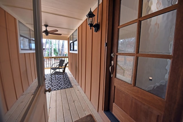 exterior space with covered porch and ceiling fan