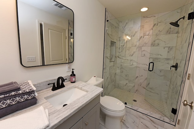 bathroom with toilet, recessed lighting, vanity, marble finish floor, and a marble finish shower