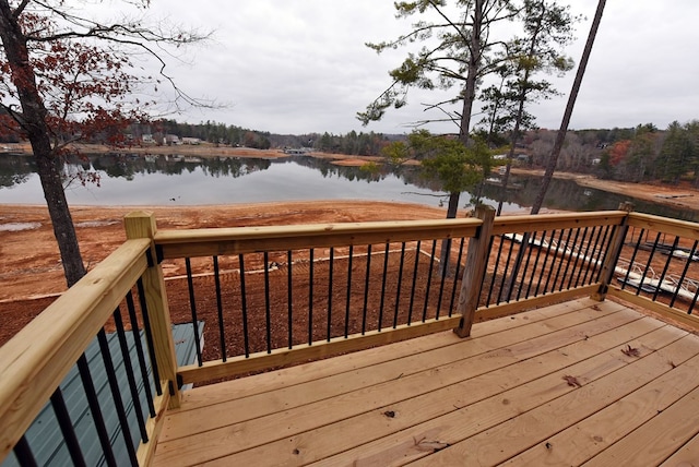 wooden deck with a water view