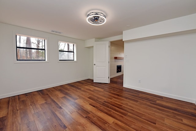 basement featuring dark wood-type flooring