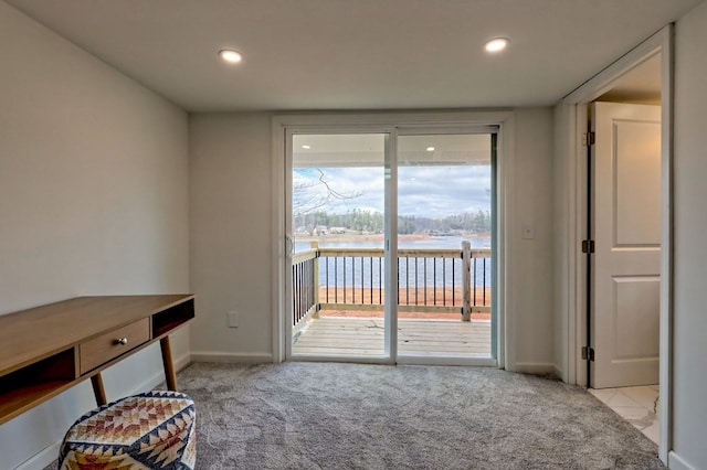 interior space with light carpet, baseboards, and recessed lighting