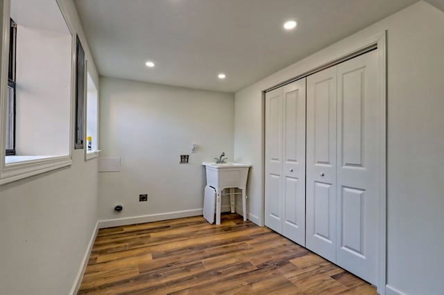 washroom with laundry area, baseboards, wood finished floors, hookup for an electric dryer, and recessed lighting