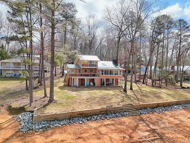 view of front of home with stairway and a wooden deck