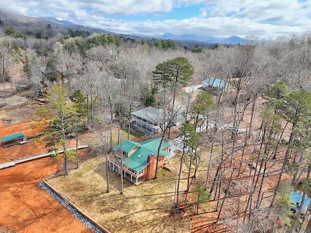 bird's eye view with a forest view and a mountain view