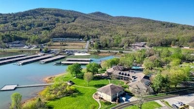 bird's eye view with a water and mountain view