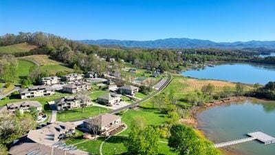 drone / aerial view with a water and mountain view