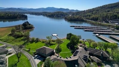 aerial view featuring a water and mountain view