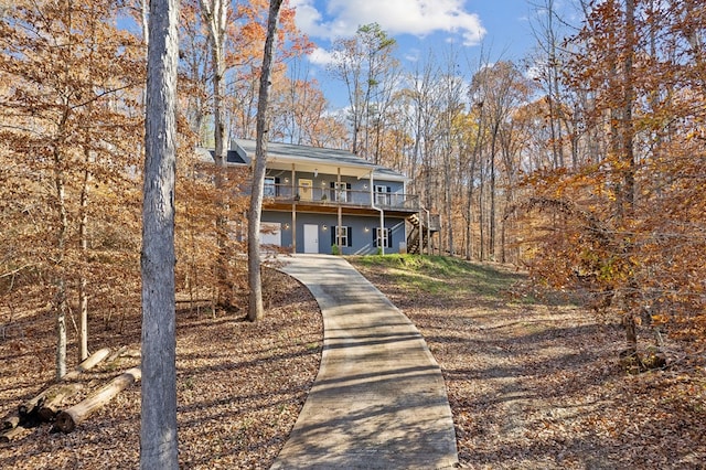 view of front of home with a garage and a deck