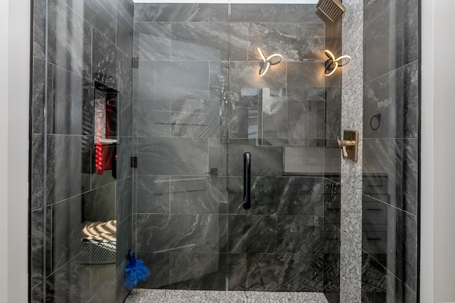 bathroom with a shower with shower door