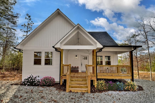 view of front of property featuring a porch and roof with shingles