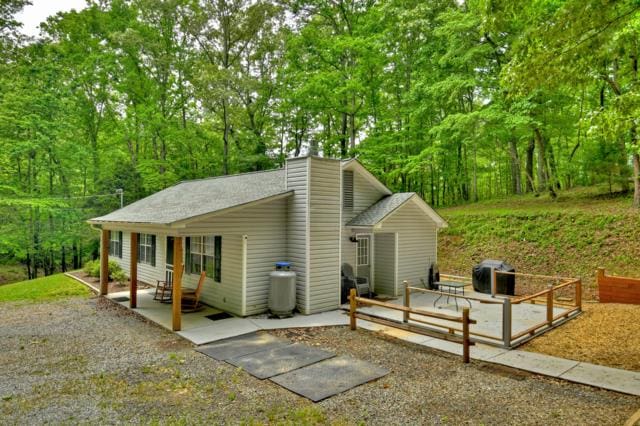 151 Padget Ln, Ellijay, GA 30540 - view of front of house featuring a patio area and a chimney