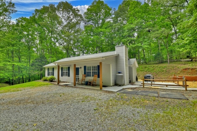 151 Padget Ln, Ellijay, GA 30540 - single story home with covered porch and a chimney