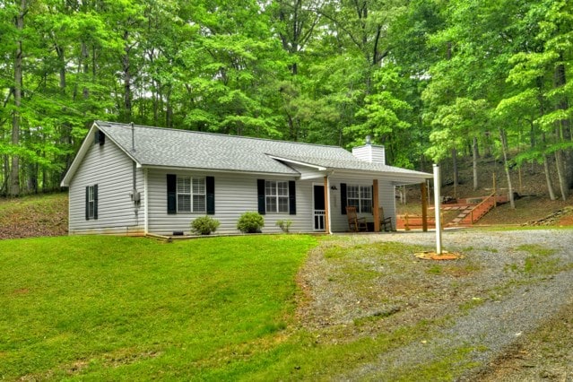 151 Padget Ln, Ellijay, GA 30540 - ranch-style house featuring a chimney, a front lawn, a shingled roof, and a porch