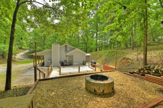 151 Padget Ln, Ellijay, GA 30540 - rear view of house featuring an outdoor fire pit and a patio