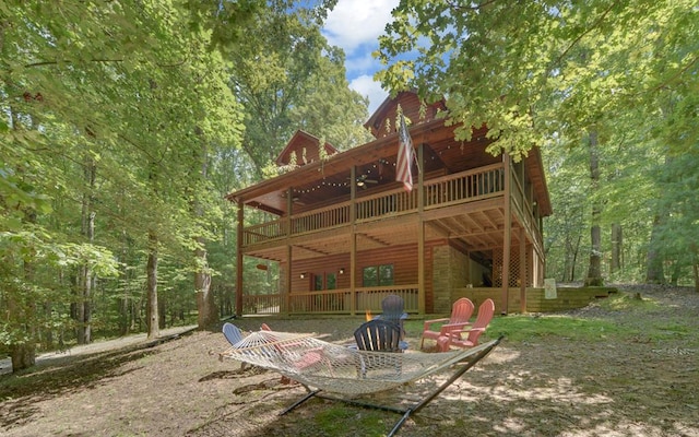 back of property featuring a wooden deck