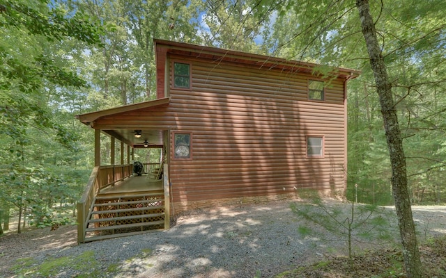 view of side of property with covered porch