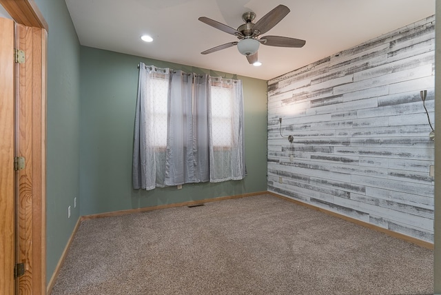 carpeted empty room with ceiling fan