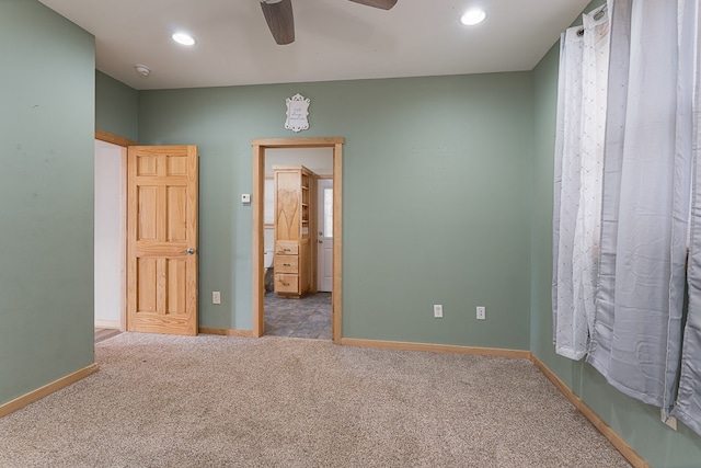 unfurnished bedroom with ceiling fan and carpet floors