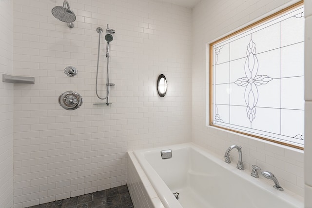 bathroom featuring shower with separate bathtub