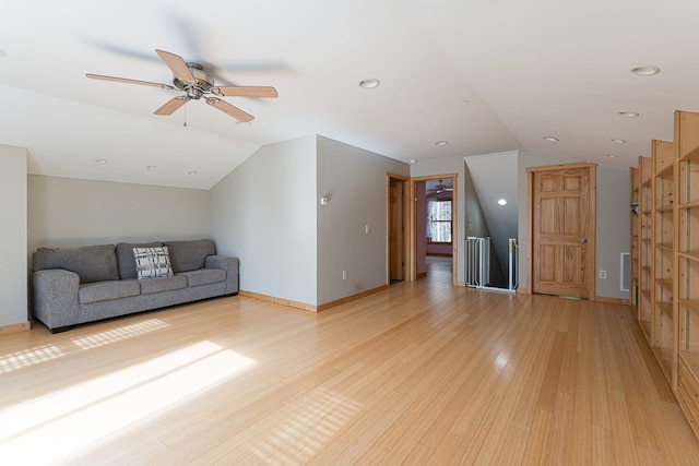 unfurnished living room with light wood-type flooring, lofted ceiling, and ceiling fan