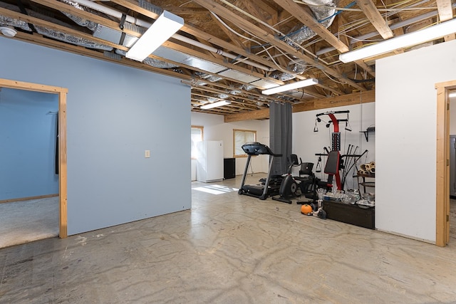 exercise area featuring concrete floors