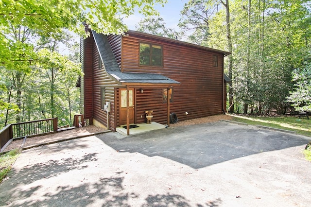 view of front of property featuring roof with shingles