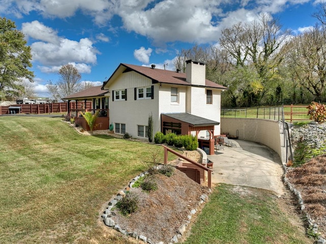 exterior space with a lawn and a patio