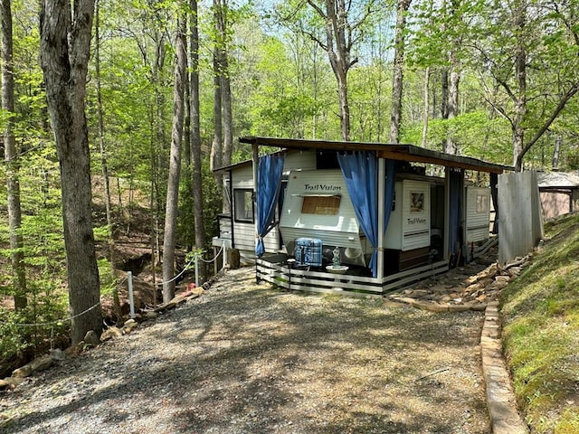 view of outbuilding with a carport