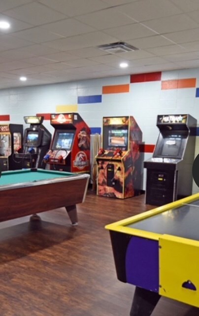 playroom featuring a drop ceiling, pool table, and dark wood-type flooring