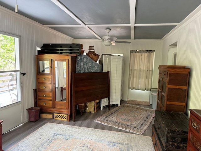 bedroom with coffered ceiling, ornamental molding, and dark wood-type flooring