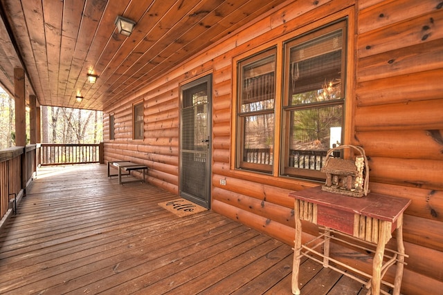 wooden terrace with a porch