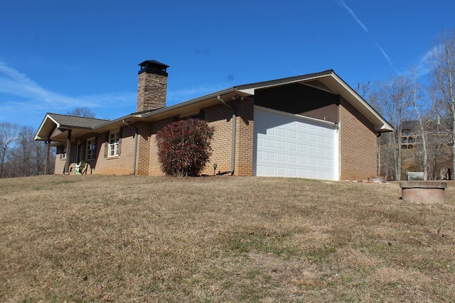 view of home's exterior featuring a garage and a yard