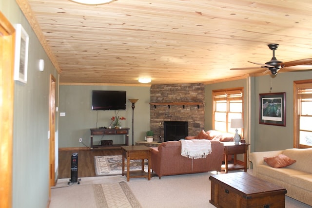 carpeted living room featuring wood ceiling, ceiling fan, and a fireplace