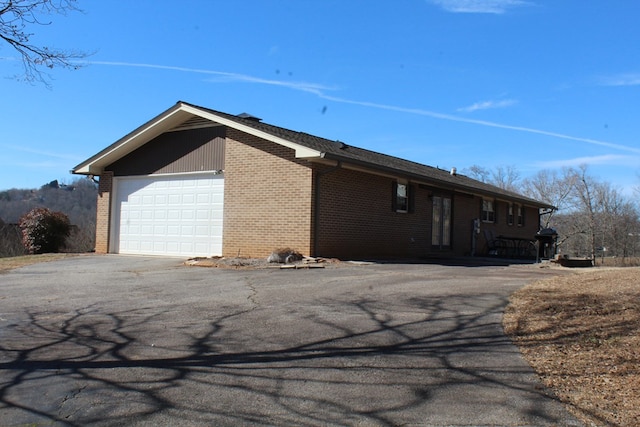 view of property exterior with a garage