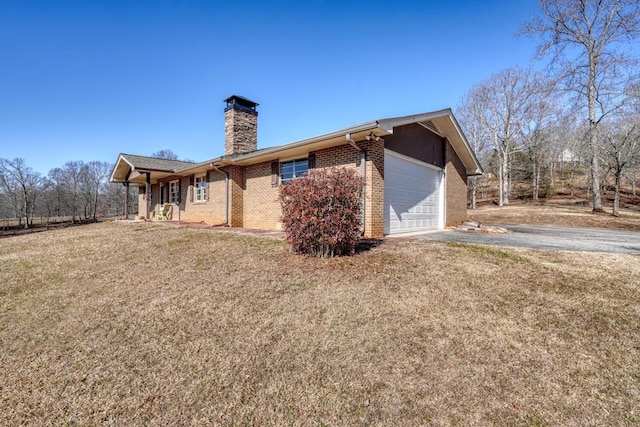 view of home's exterior with a yard and a garage