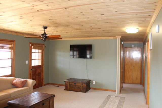 living room featuring ceiling fan, light carpet, and wood ceiling