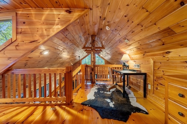 additional living space with lofted ceiling, plenty of natural light, wooden ceiling, and light wood-type flooring