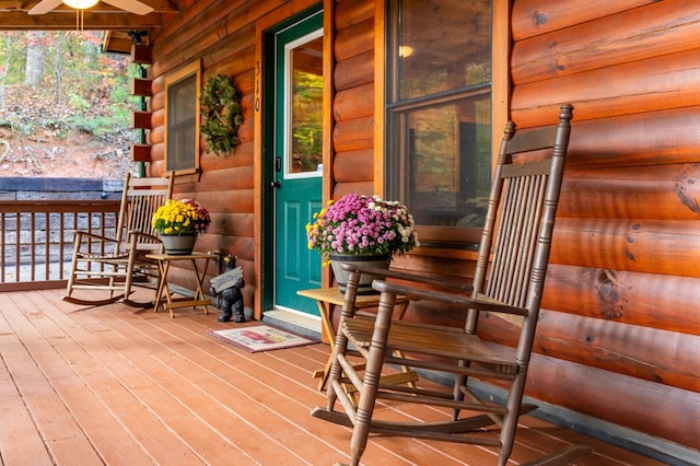 deck featuring ceiling fan and a porch