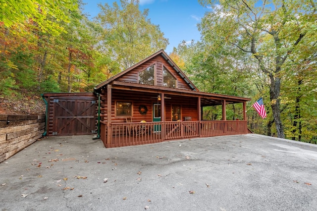 log cabin with a porch